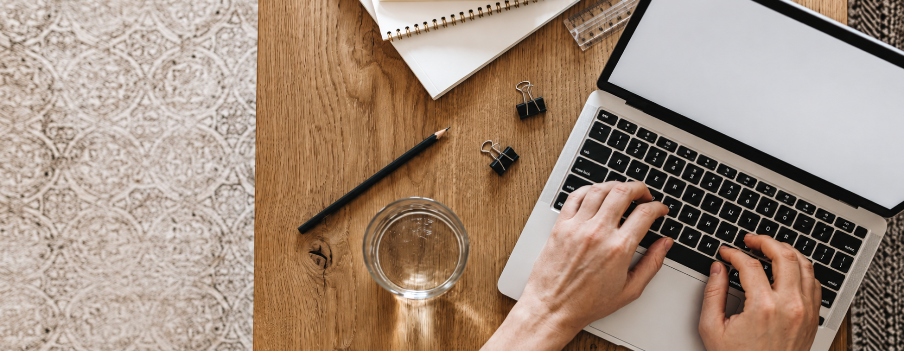 man typing on laptop