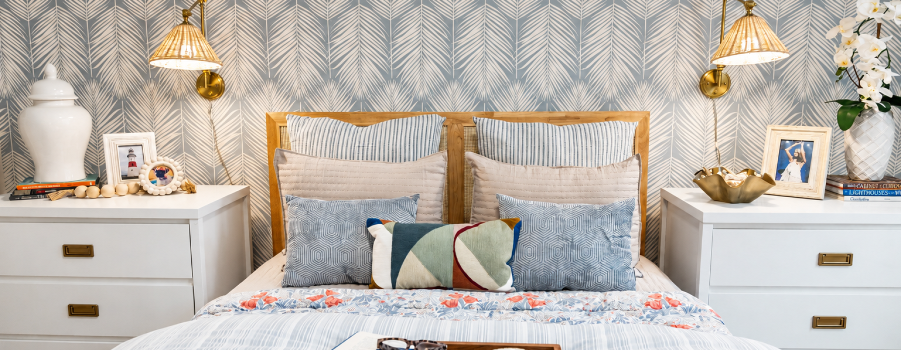 Bedroom with large bed, lamps, end tables, and natural light