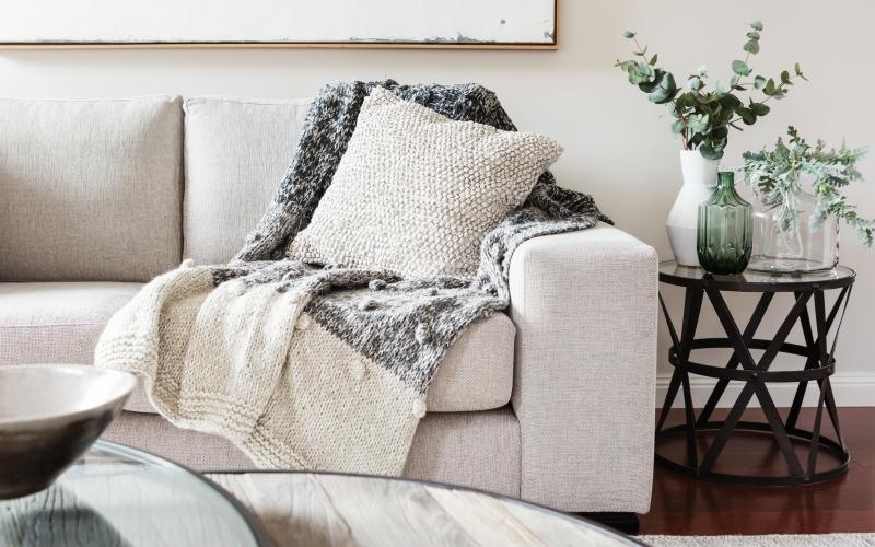 a couch with a white pillow